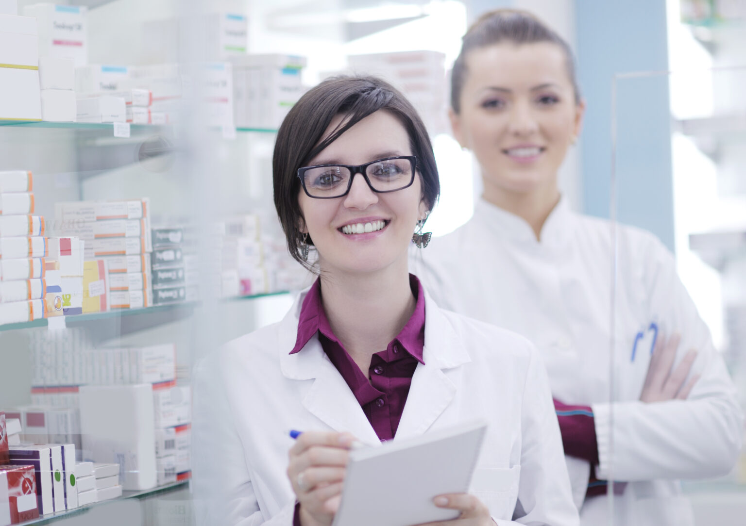 Friendly pharmacist helping a customer at ActiveCare Pharmacy in Carrollton, Texas